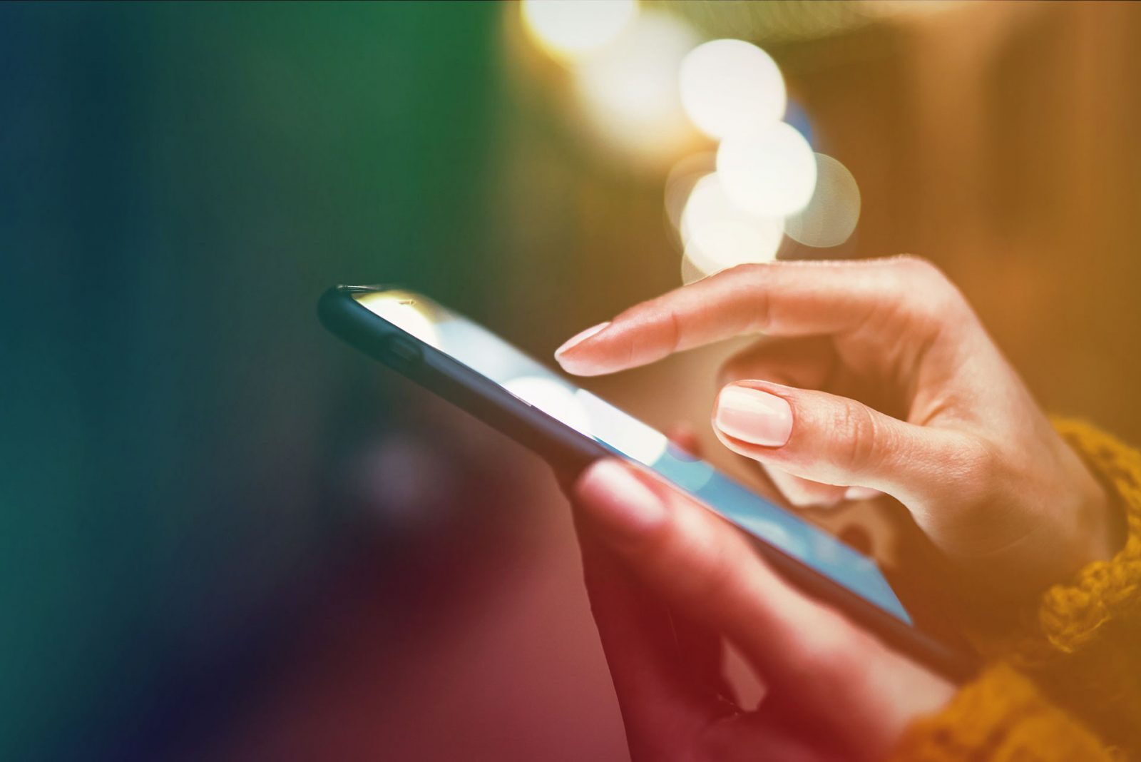pair of hands using a smartphone